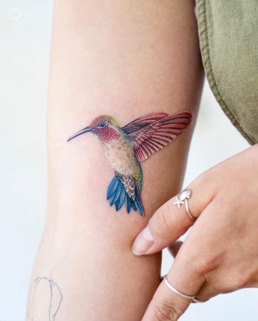 Vibrant Shoulder Hummingbird with Rainbow Feathers Tattoo Design