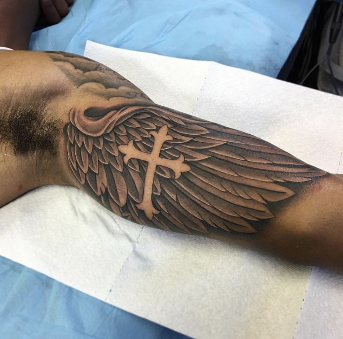 Winged Cross Inner Bicep Tattoo Tattoo Design