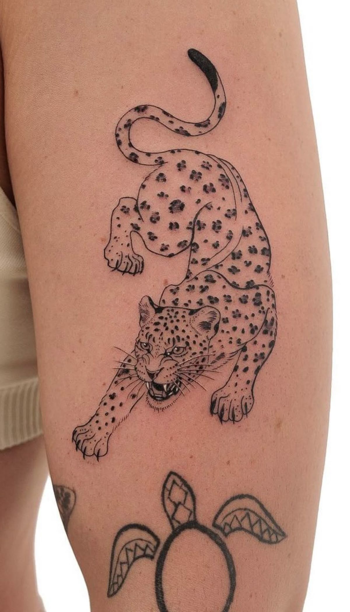 Black Silhouette Jaguar With Floral Inlay Tattoo Design
