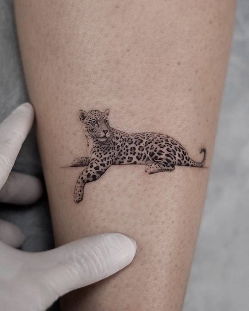 Minimalist Pouncing Jaguar Outline Tattoo Design