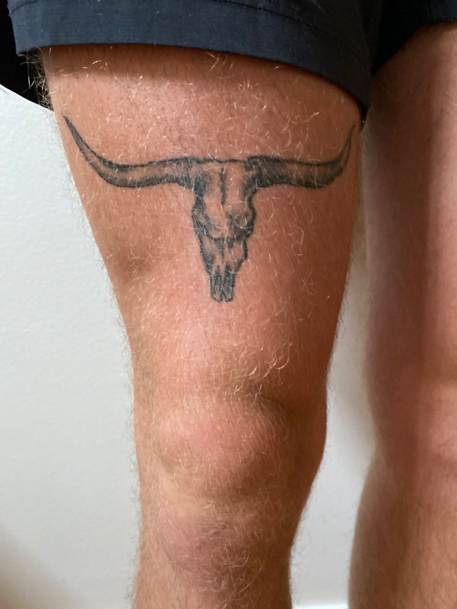 Longhorn Skull Emblem, a tattoo design rendered in clean detailed linework for the thigh.