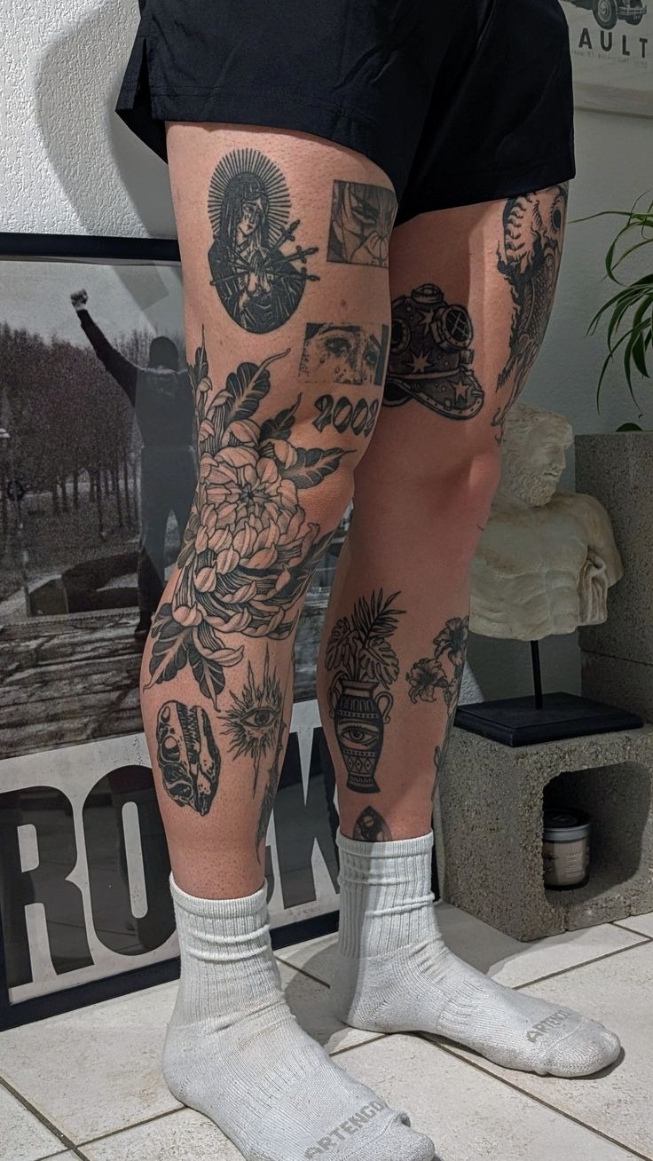 Patchwork Masterpiece Thigh Tattoo, a tattoo design rendered in clean detailed linework.