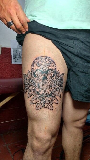 Sugar Skull with Florals, a tattoo design rendered in bold traditional for the thigh.