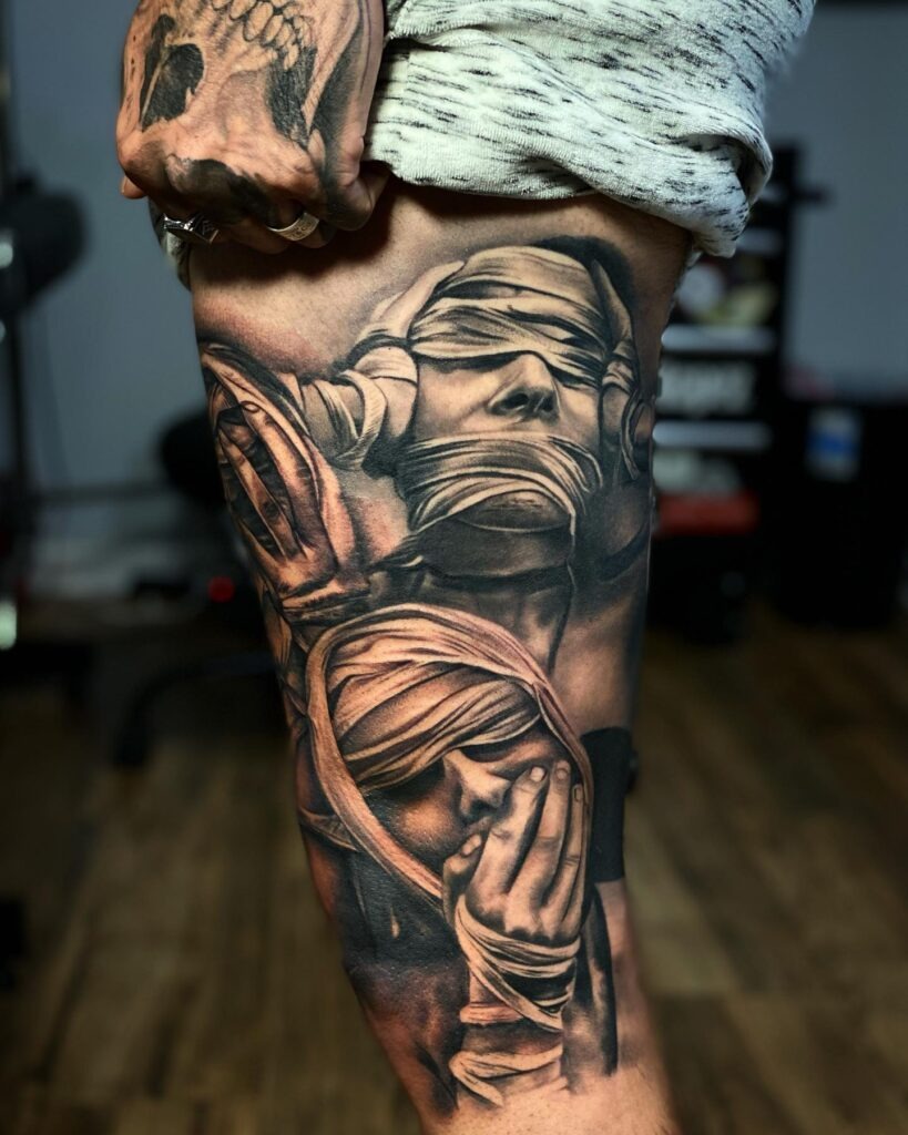 Blindfolded Figures Thigh Tattoo Tattoo Design