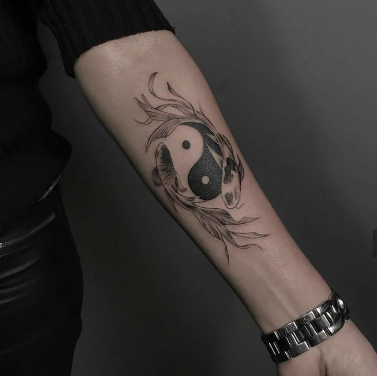 In the eternal symbol of Yin and Yang, two intricate Koi fish delicately connect their bodies.