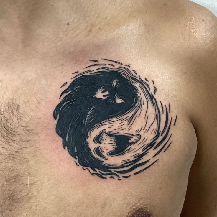 This black and white drawing of a lion and lioness creates an aggressive yin-yang design that spreads across the chest.