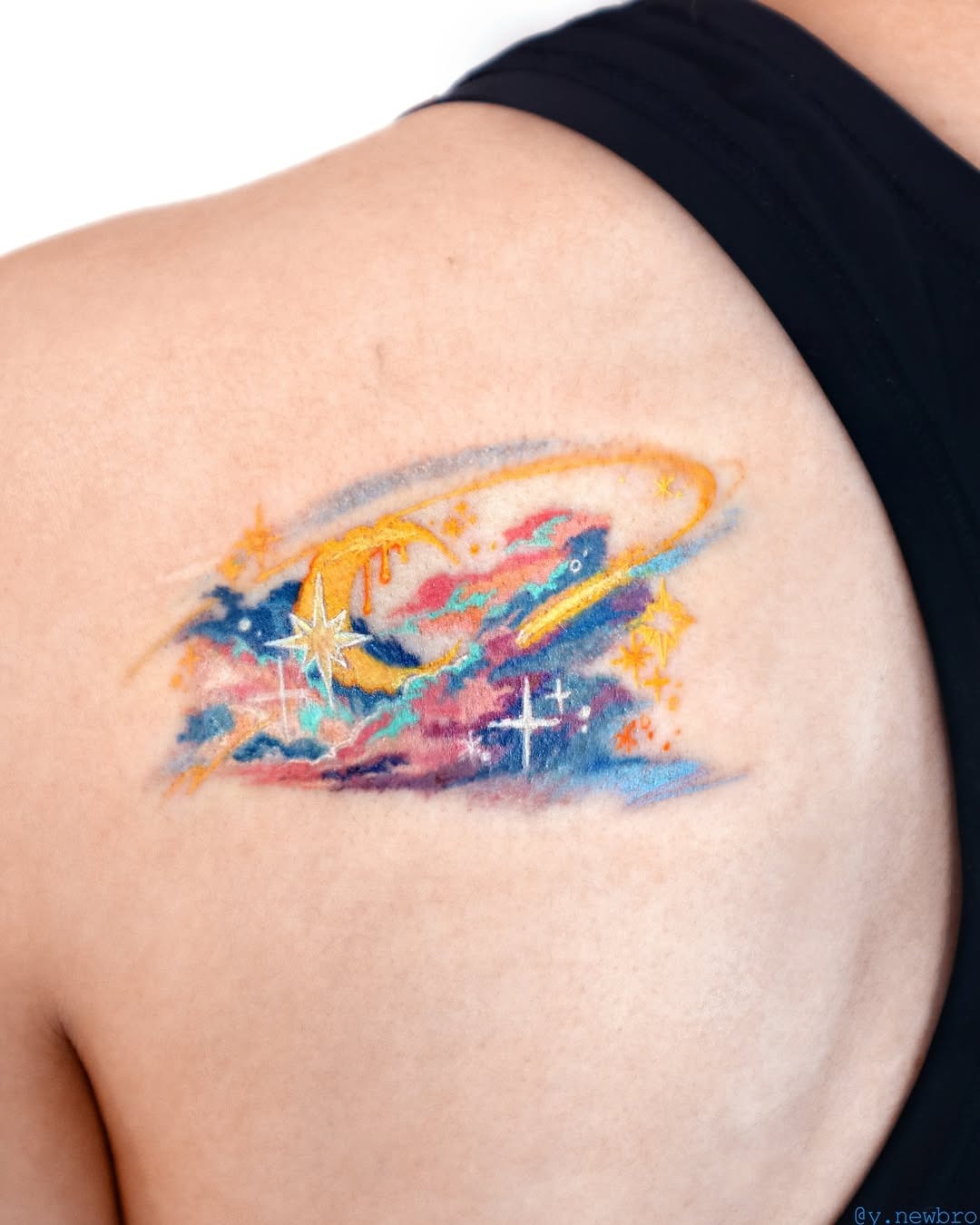 The design centers on blend colors depicting celestial imagery that reads clearly at a glance.