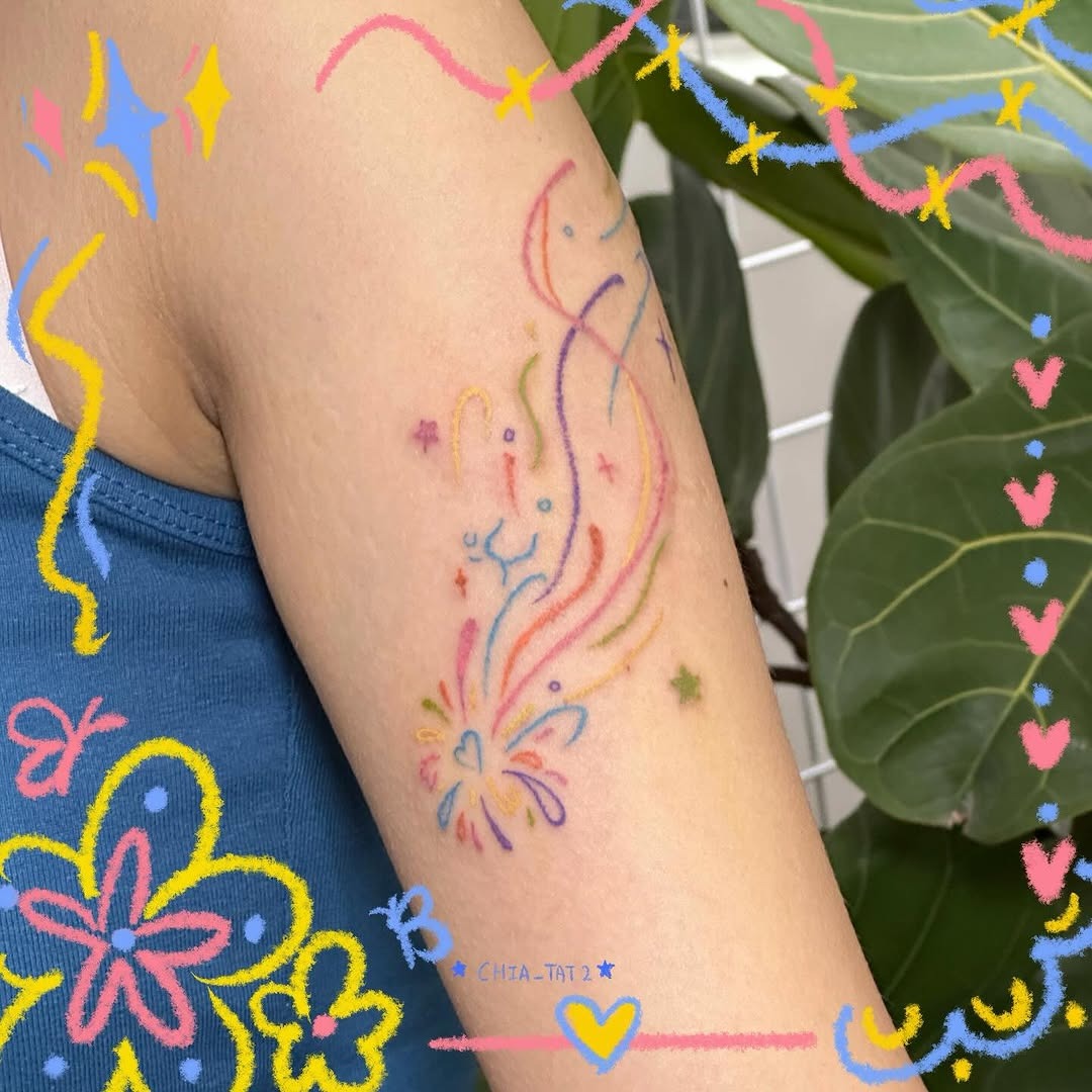 This meteor tattoo features colors with playful swirls, bringing a whimsical vibe to the design.