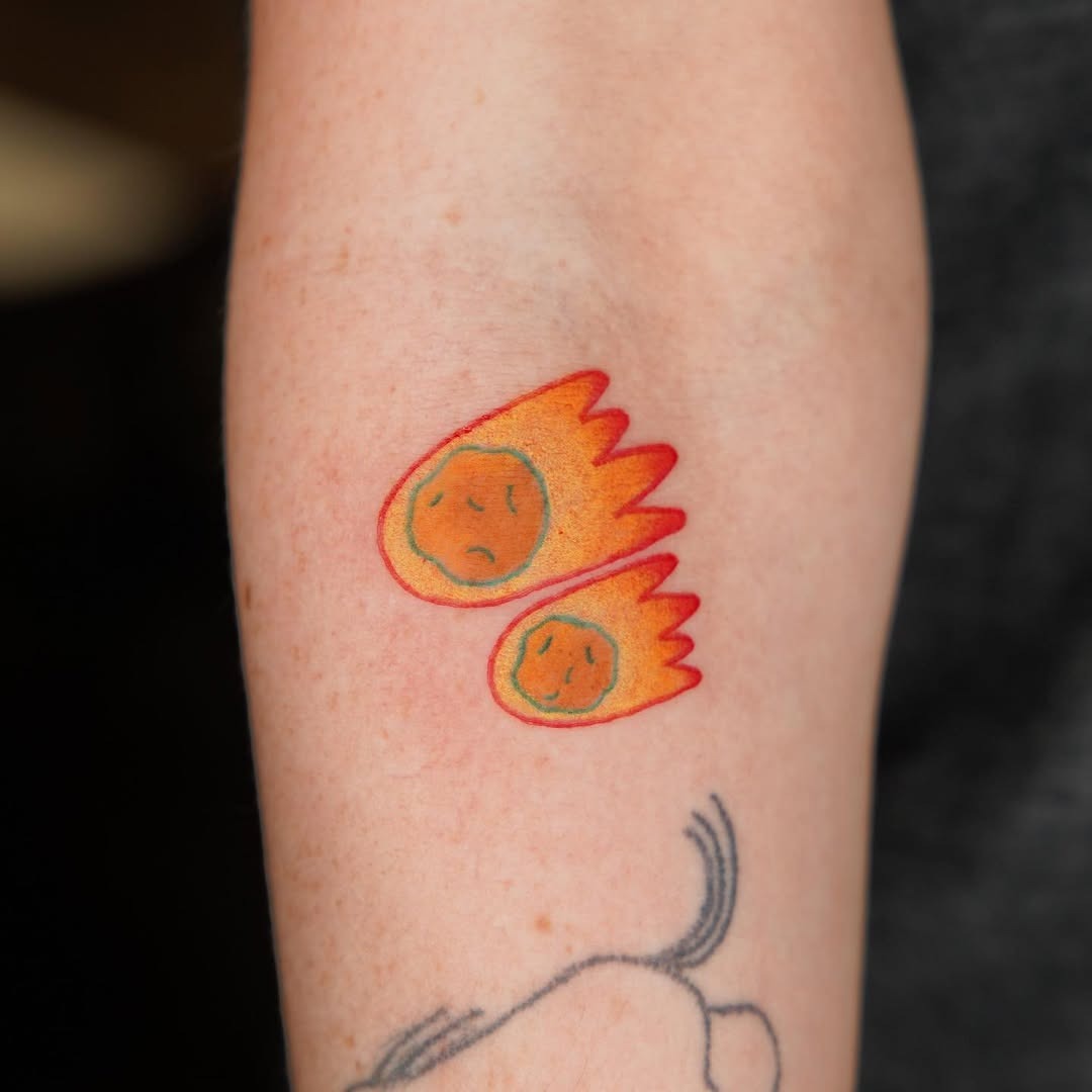 These meteor tattoos feature bright colors with expressive faces, showing a playful yet dynamic vibe.
