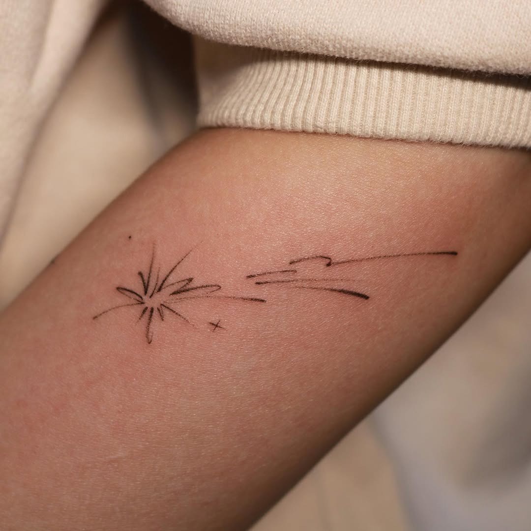 This tattoo features a simple yet striking design of a meteor.