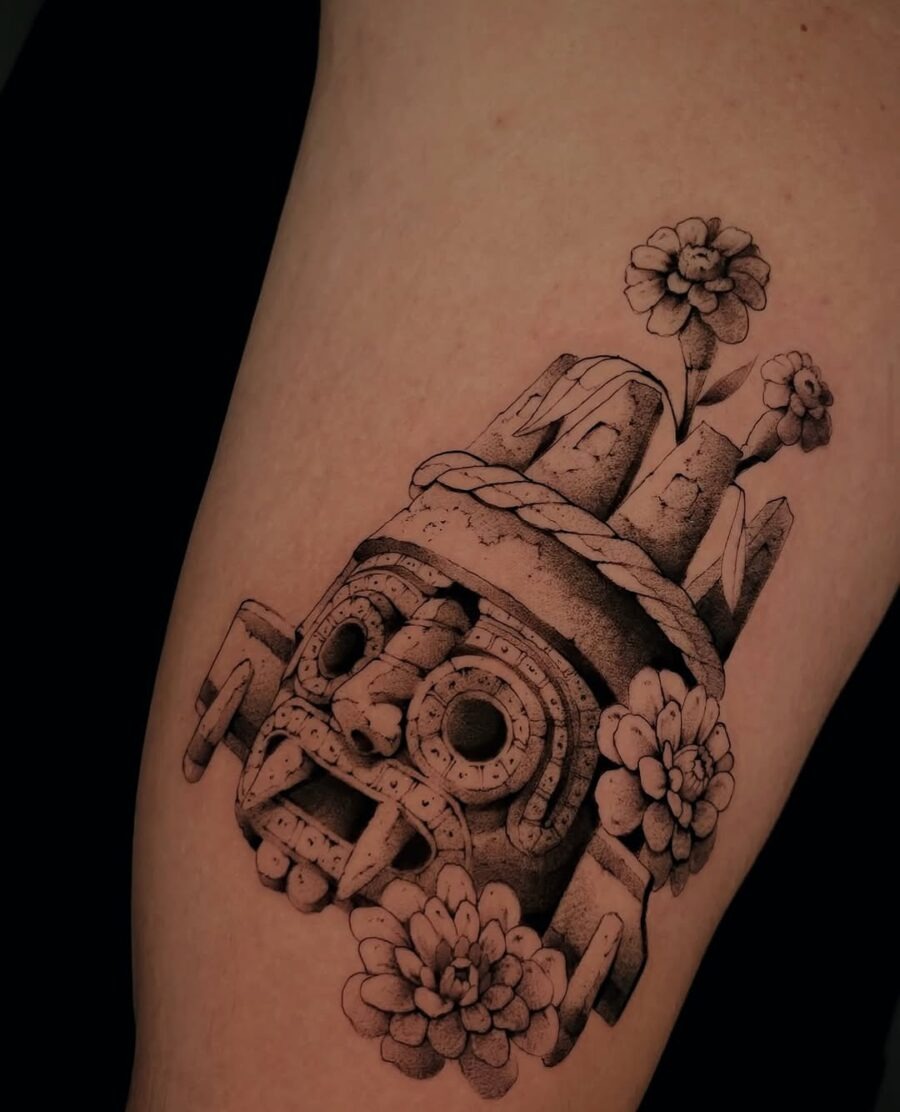 Intricate Aztec skull tattoo design with flowers Tattoo Design