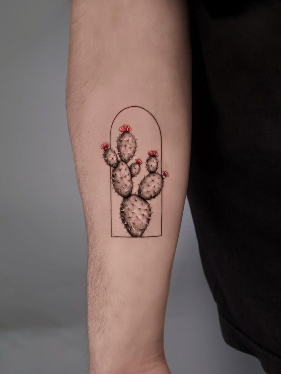 Vibrant cactus tattoo with floral accents Tattoo Design