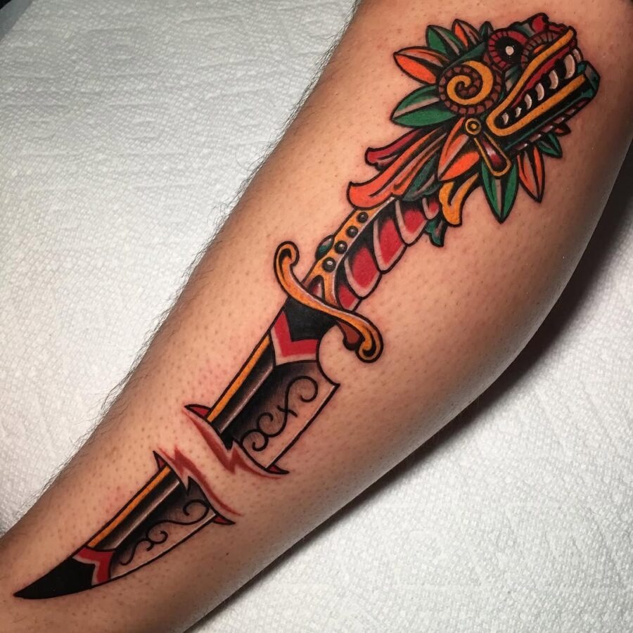 Vibrant dagger tattoo with floral elements Tattoo Design