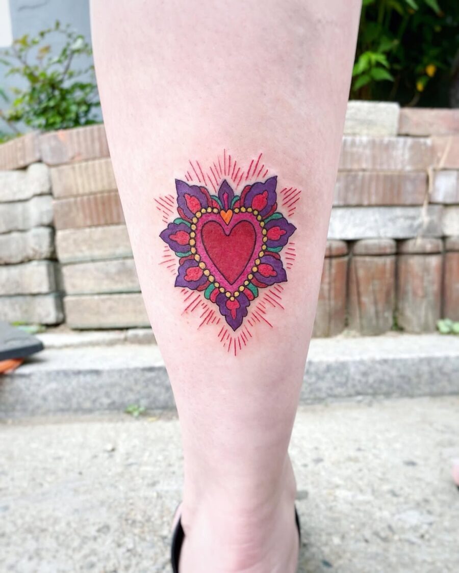 Vibrant heart tattoo with ornamental details Tattoo Design