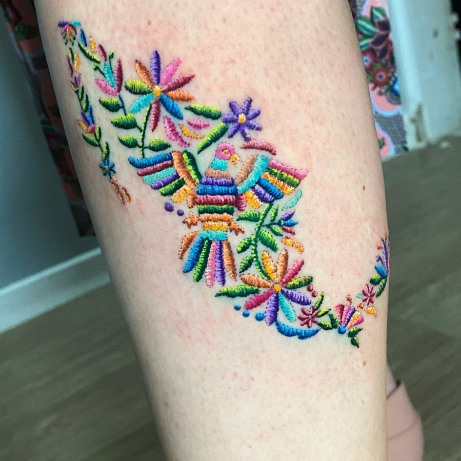 Vivid floral design featuring a mythical bird Tattoo Design