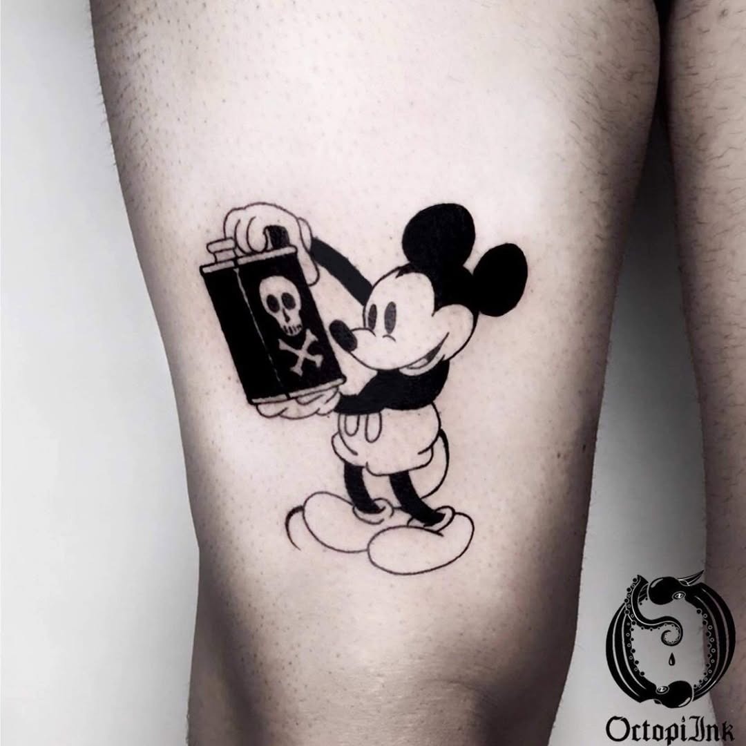 This tattoo features Mickey Mouse playfully holding a canister marked with a skull, merging childhood nostalgia with an edgy vibe.