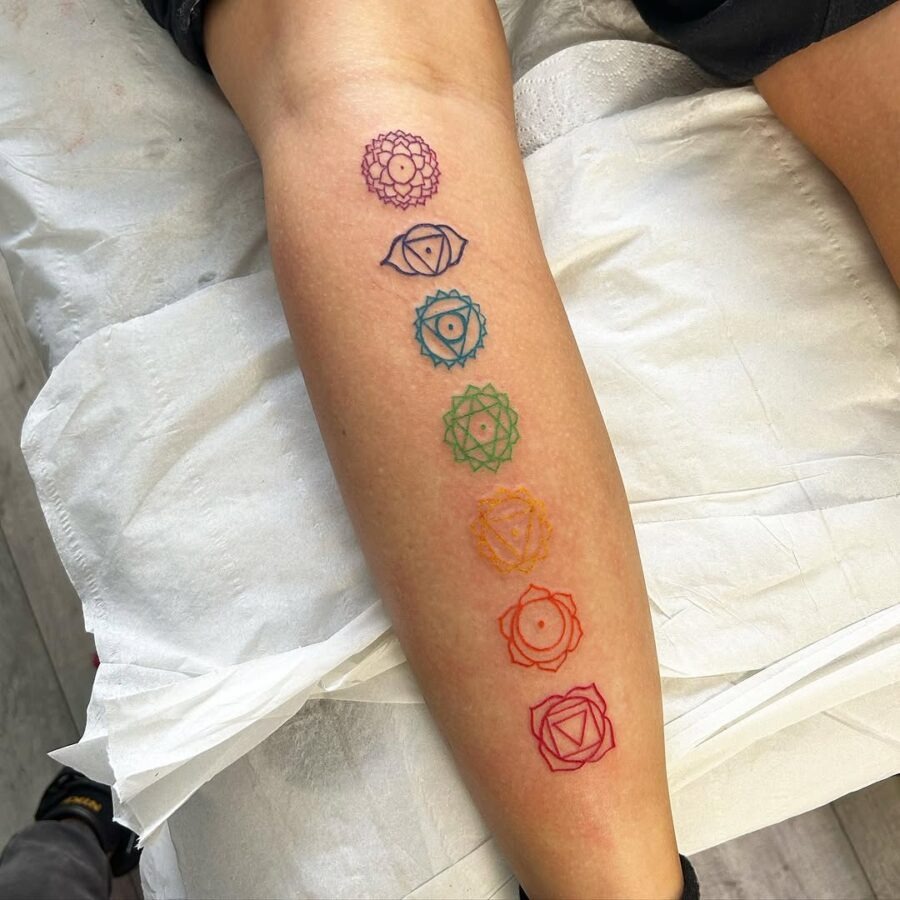 Colorful chakra tattoos symbolize balance and wellness. Tattoo Design