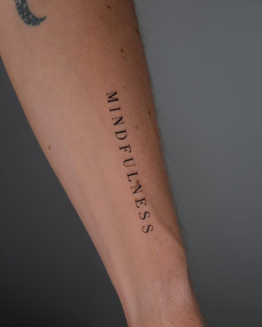 Elegant mindfulness tattoo on forearm Tattoo Design