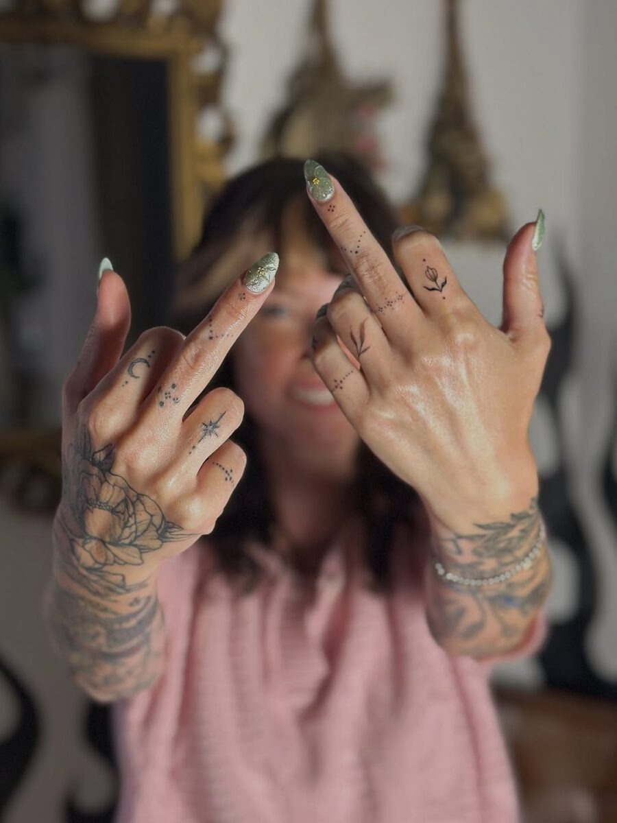 Expressive hands adorned with mindful tattoos. Tattoo Design