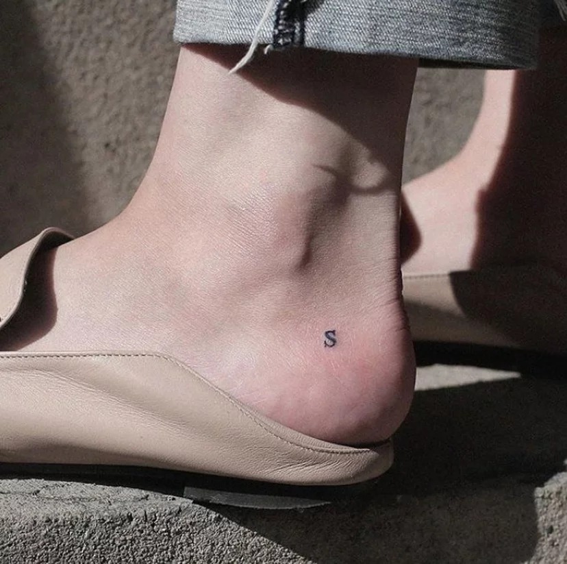 Starting with a quintessentially simple and small design, the letter A tattoo on the ankle exemplifies minimalistic beauty.