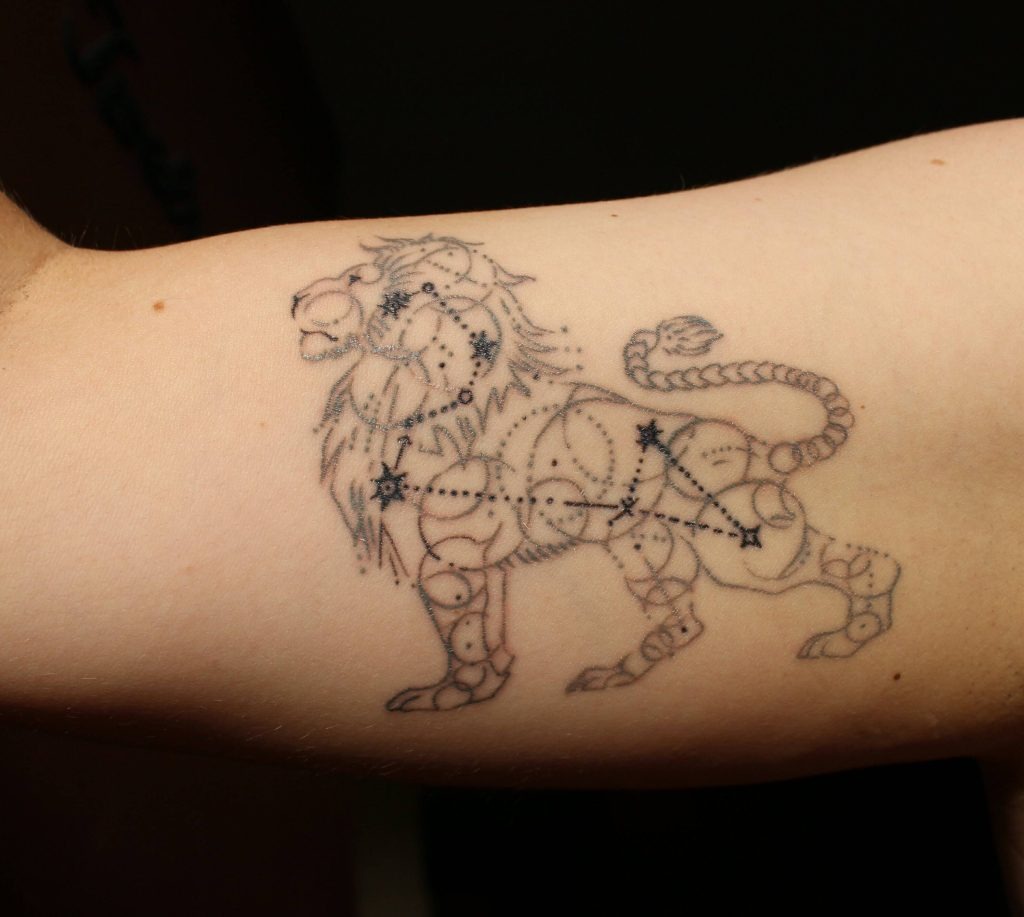 Minimalist Lion Tattoo on Back Tattoo Design