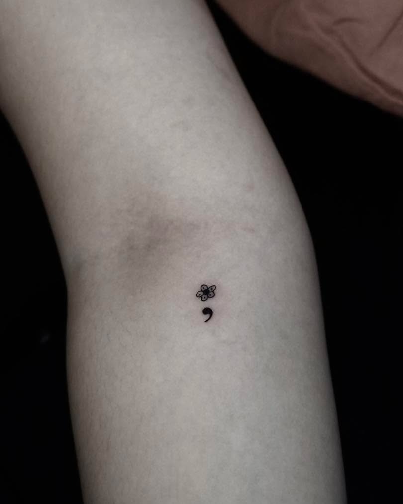 A delicate flower and semicolon tattoo design Tattoo Design