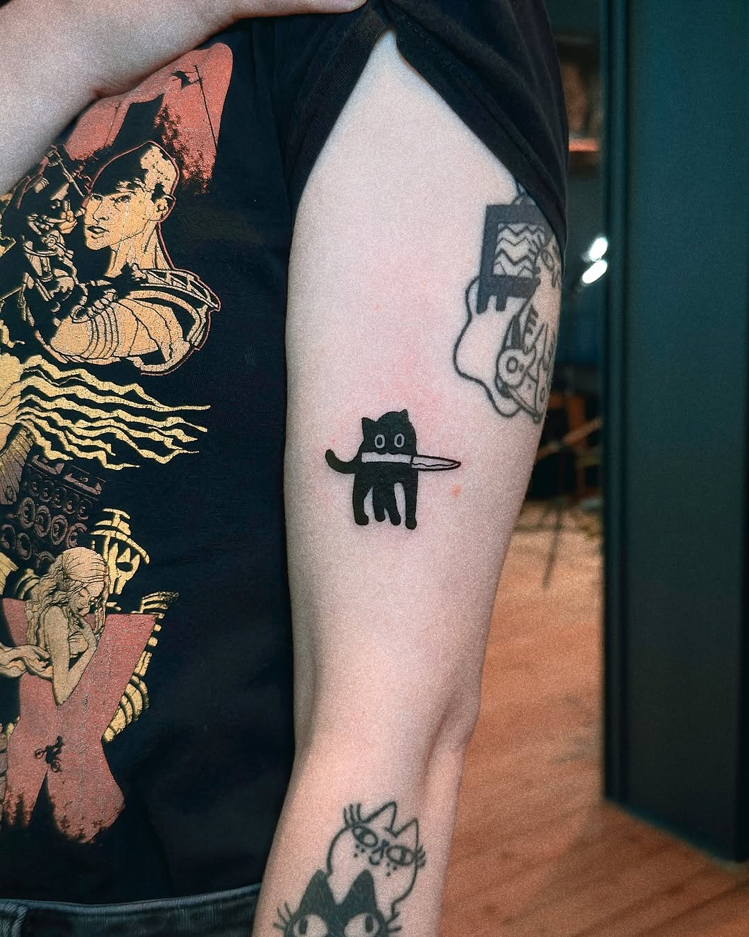 Charming minimalist cat tattoo with playful vibes Tattoo Design
