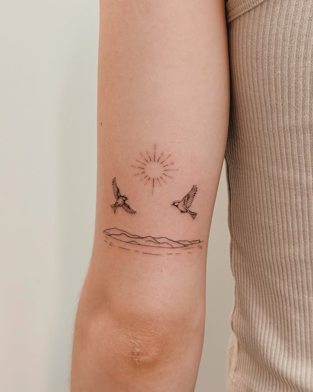 Charming minimalist tattoo of birds and sun Tattoo Design