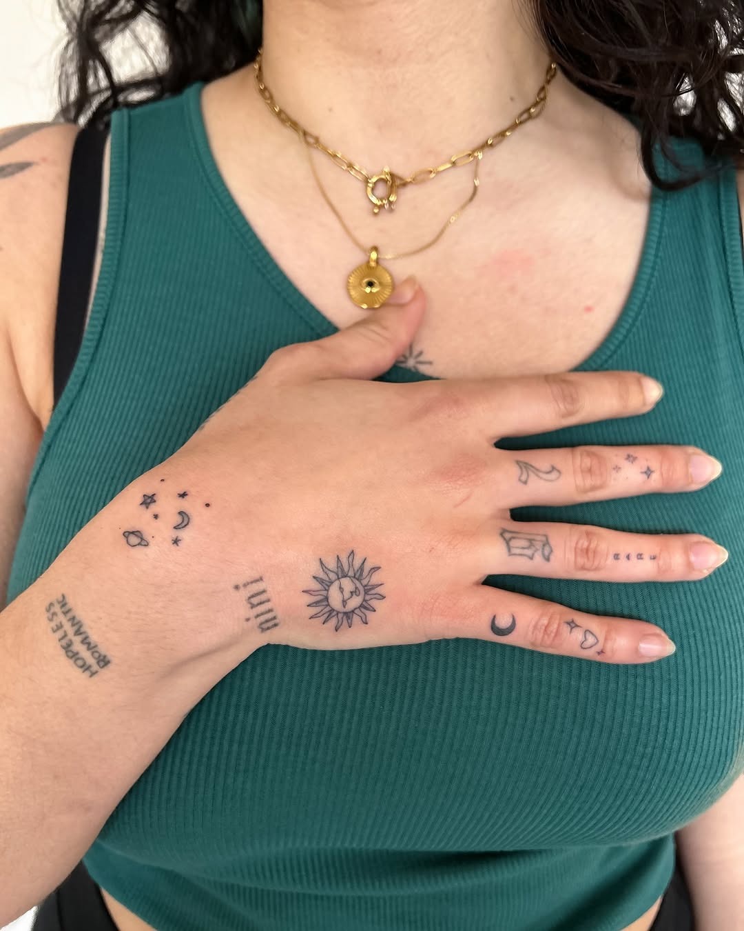 Charming minimalist tattoos on a hand Tattoo Design