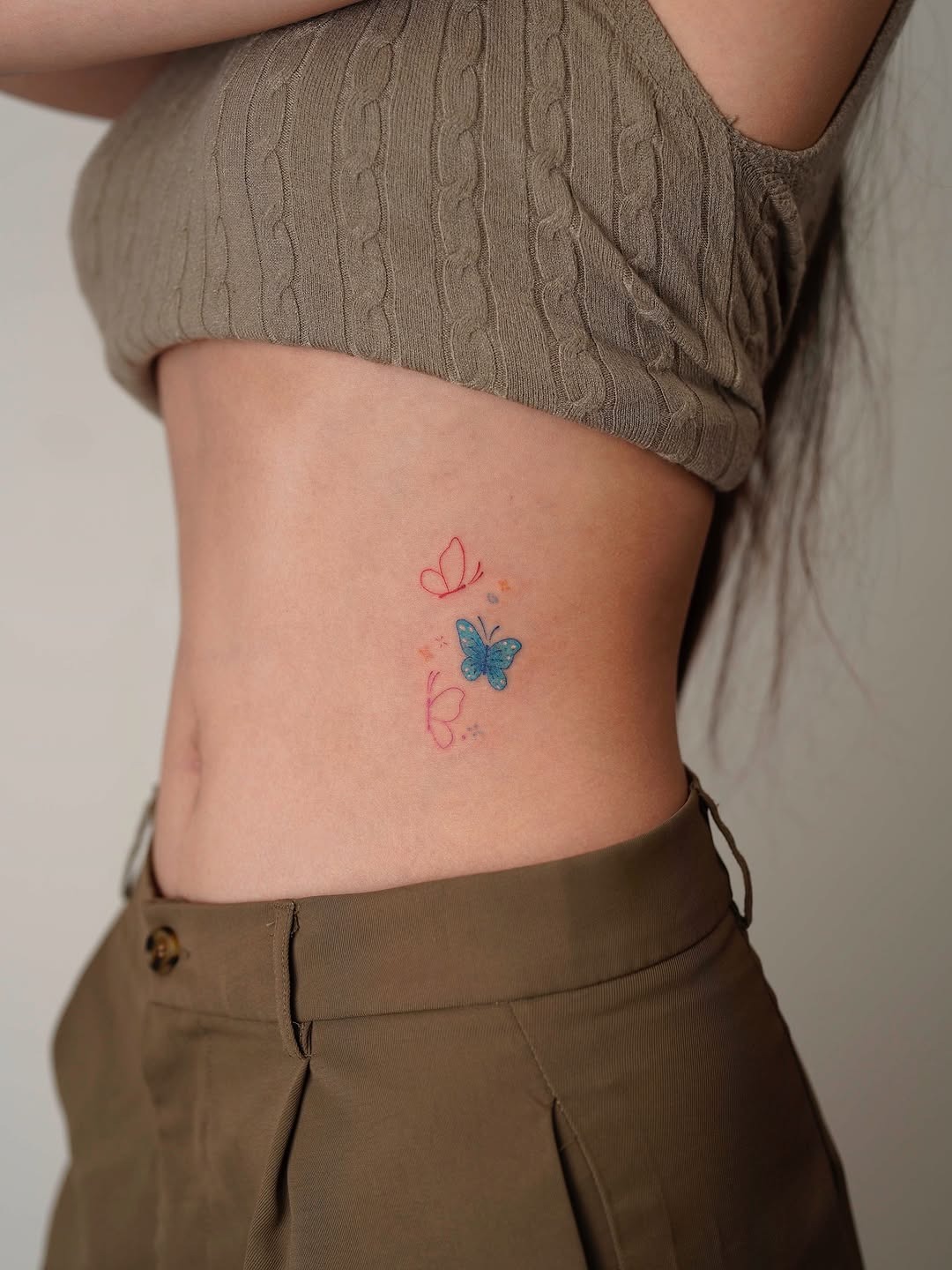 Delicate butterfly tattoo with floral accents Tattoo Design