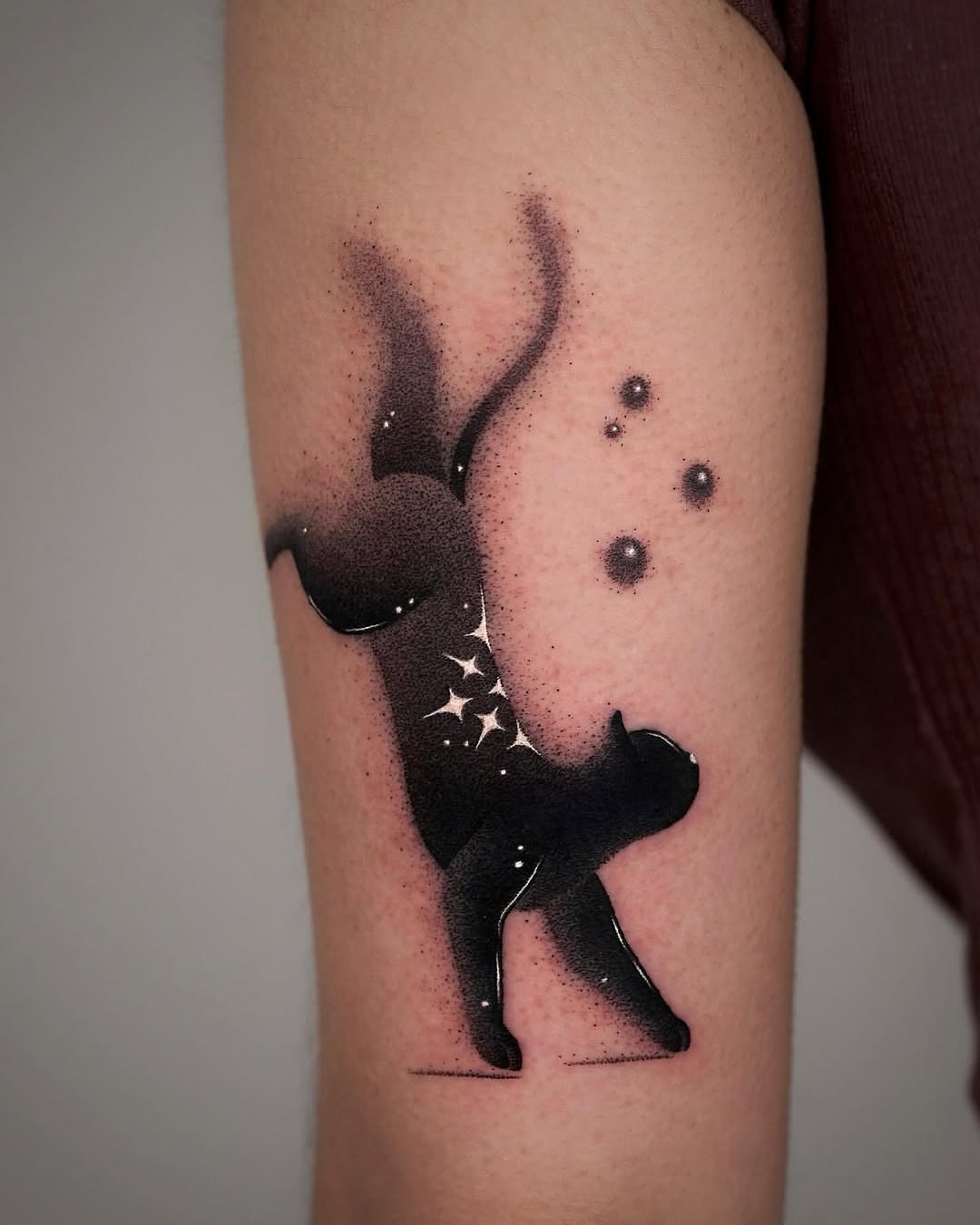 Elegant cat silhouette with cosmic elements Tattoo Design