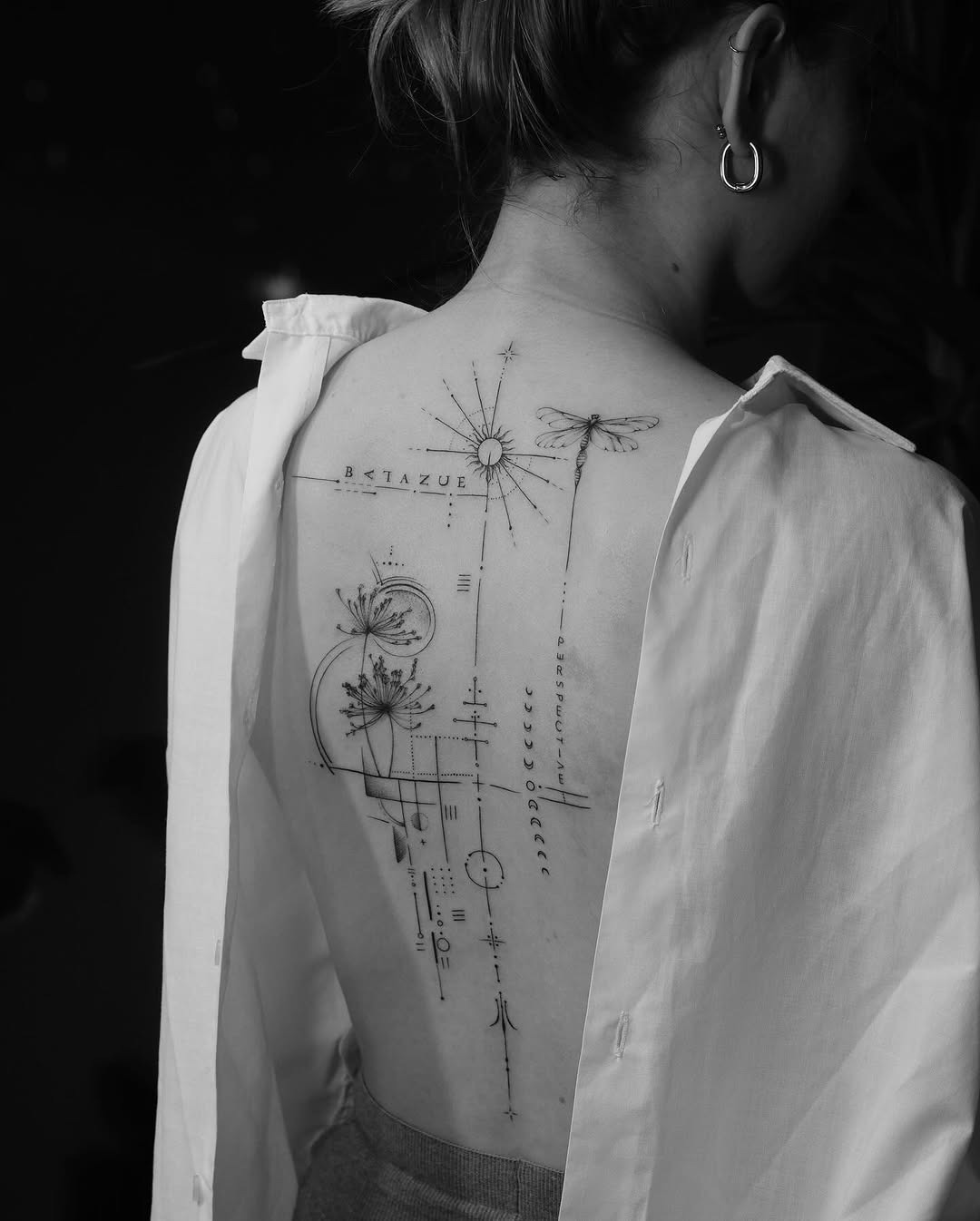 Elegant minimalist tattoo design on the back Tattoo Design