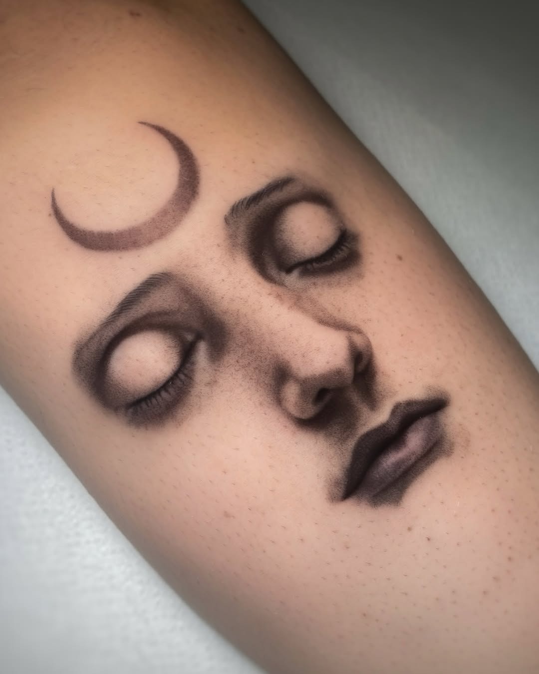 Serene face tattoo with crescent moon detail Tattoo Design