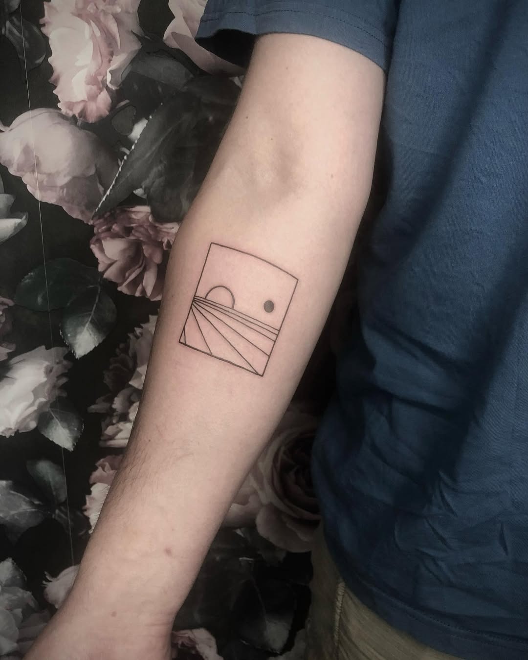 Simple geometric sunset tattoo on arm Tattoo Design
