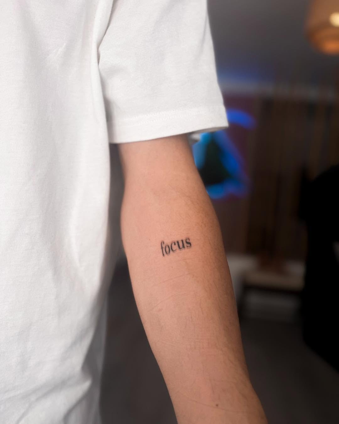 Simple yet powerful word tattoo on arm Tattoo Design