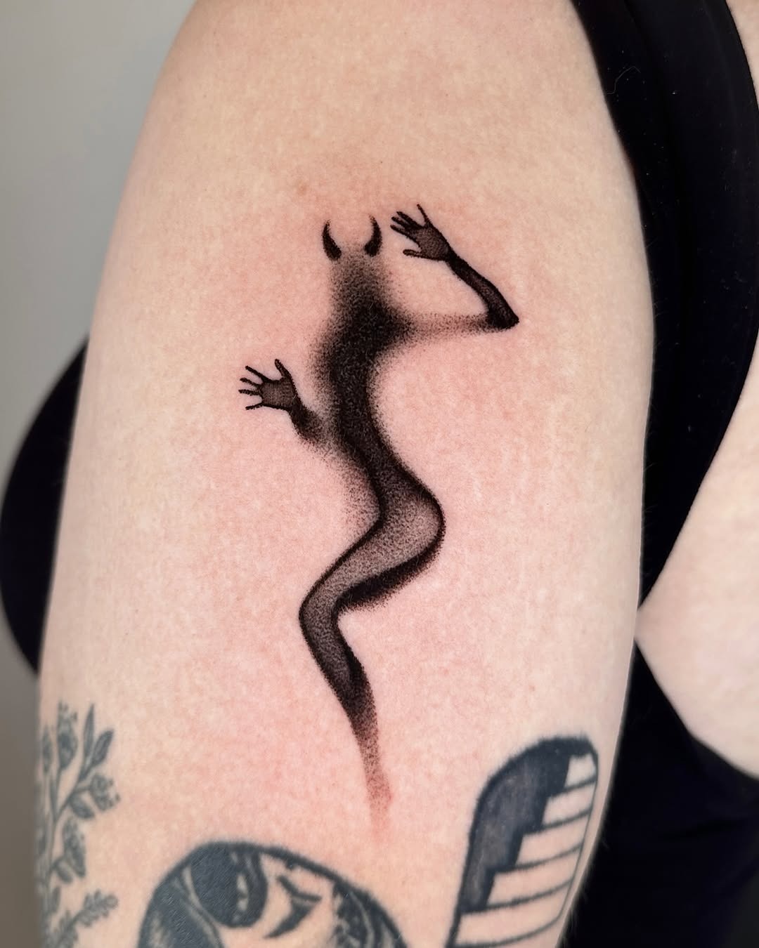 Unique minimalist devil-themed tattoo design Tattoo Design