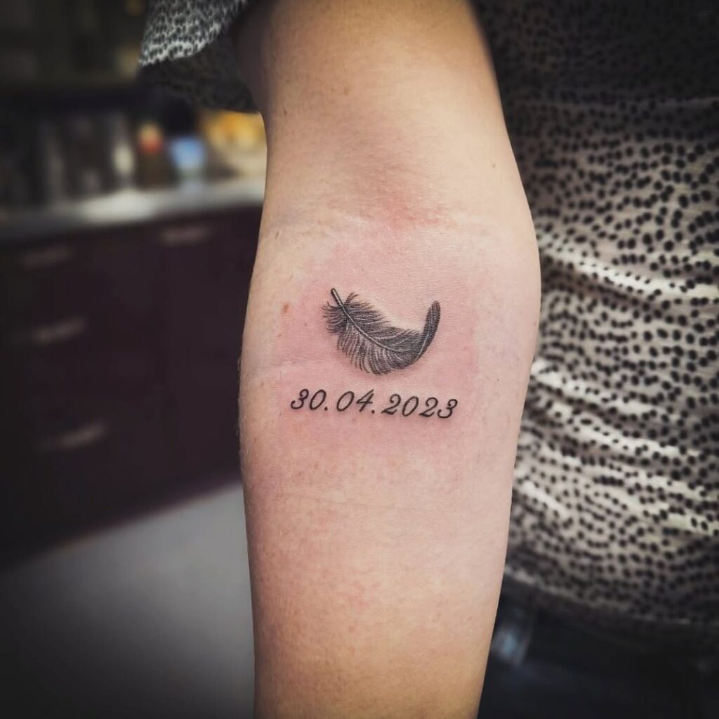 Feather and Date Memorial Tattoo Tattoo Design