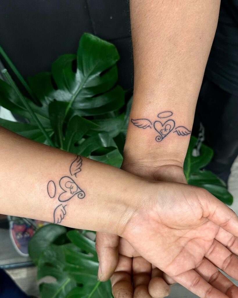 Matching Angel Heart Tattoos with Fetus Silhouette Tattoo Design