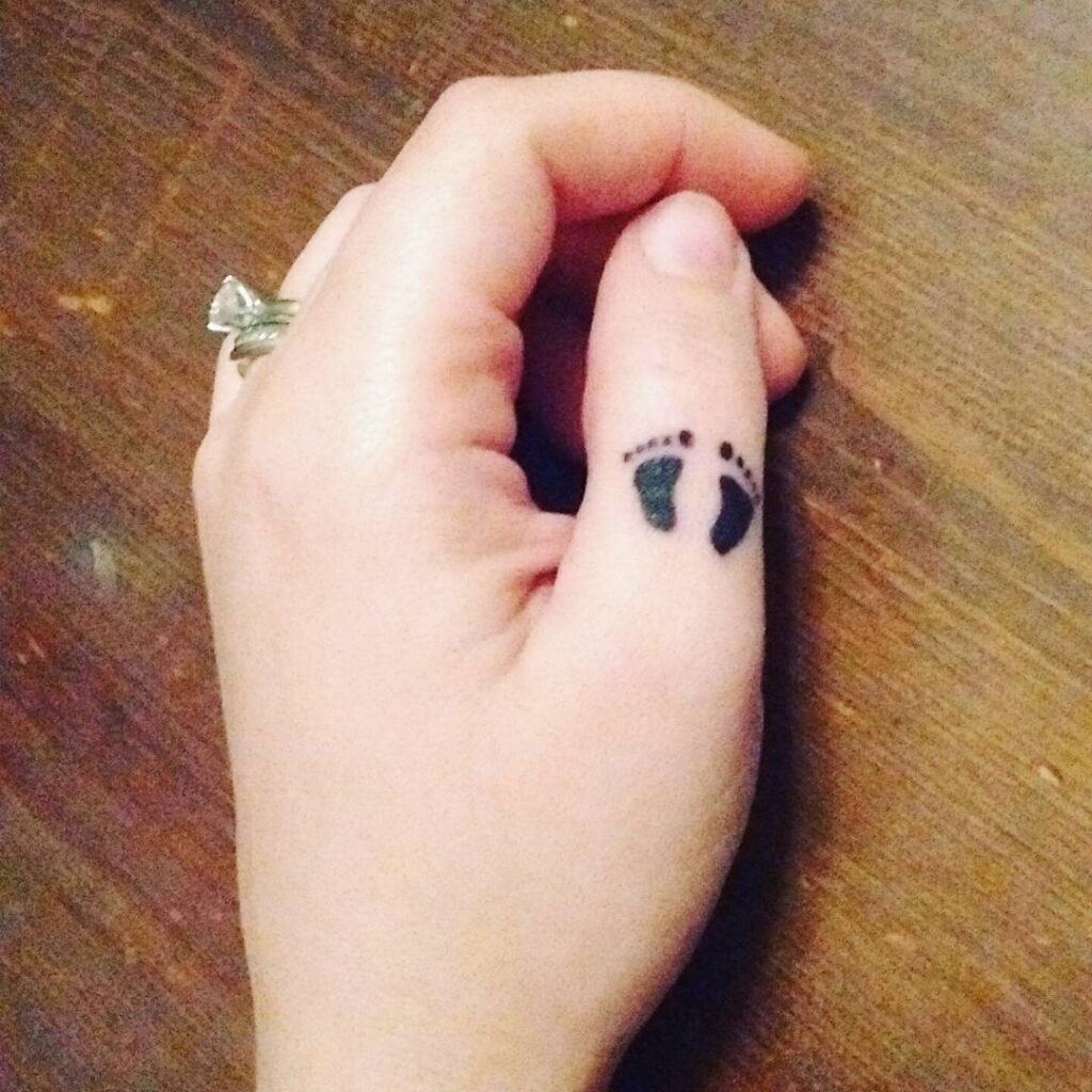 Tiny Footprints Thumb Tattoo Tattoo Design