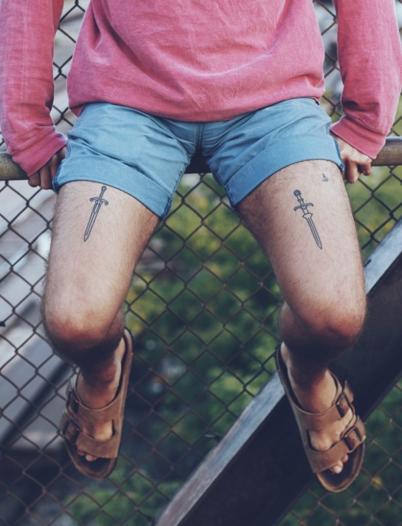 Minimalist Swords: A Simple yet Powerful Statement Tattoo Design