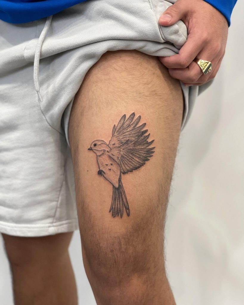 Simple Flying Bird: Freedom in Motion Tattoo Design