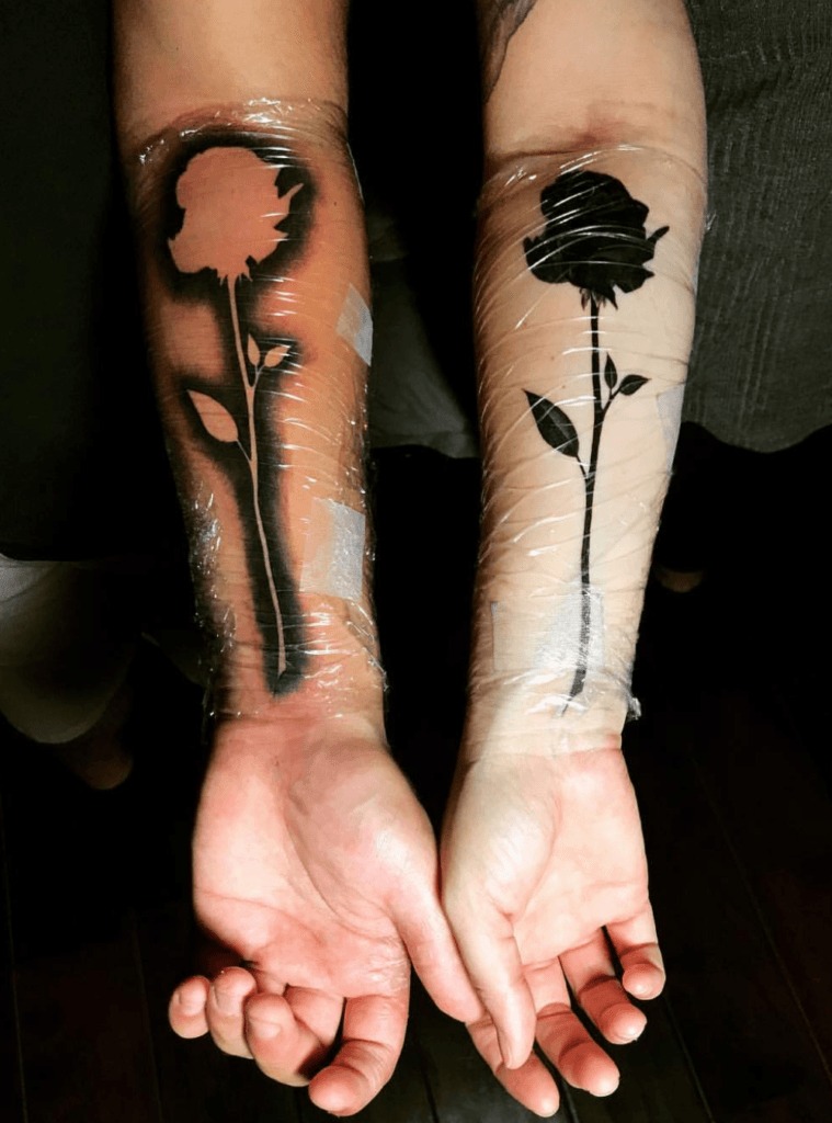 Two Birds Perched on Trees Tattoo Design