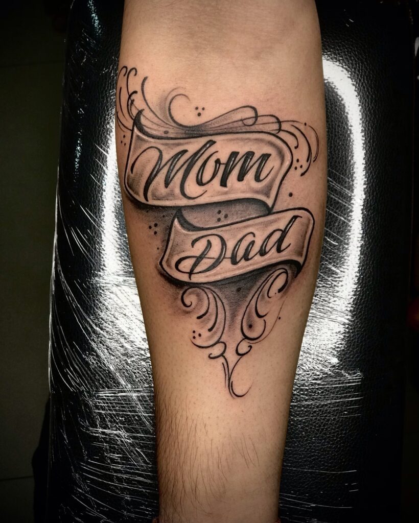 Baby Hand Holding Parents Tattoo with Heart and Leaves Tattoo Design