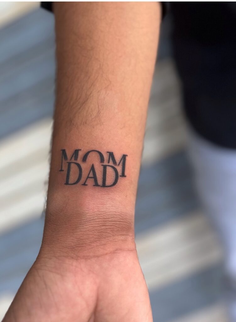 Bold Overlapping Mom Dad Wrist Tattoo Tattoo Design