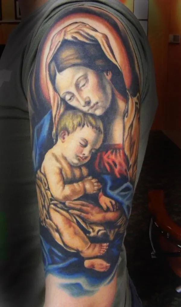 Drawing inspiration from classic Renaissance art, this tattoo portrays a mother holding her baby in a serene and loving manner.