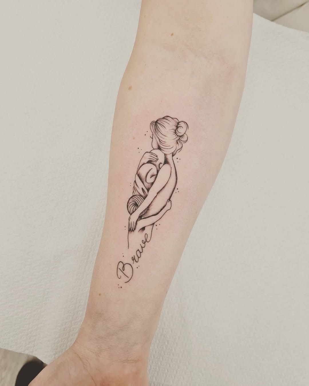 A touching tribute to motherhood and bravery Tattoo Design