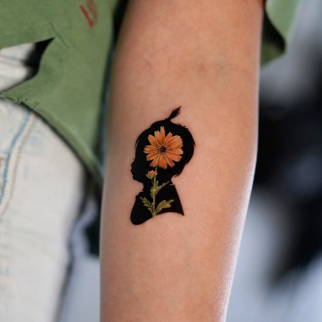 A tribute tattoo celebrating motherhood and growth Tattoo Design