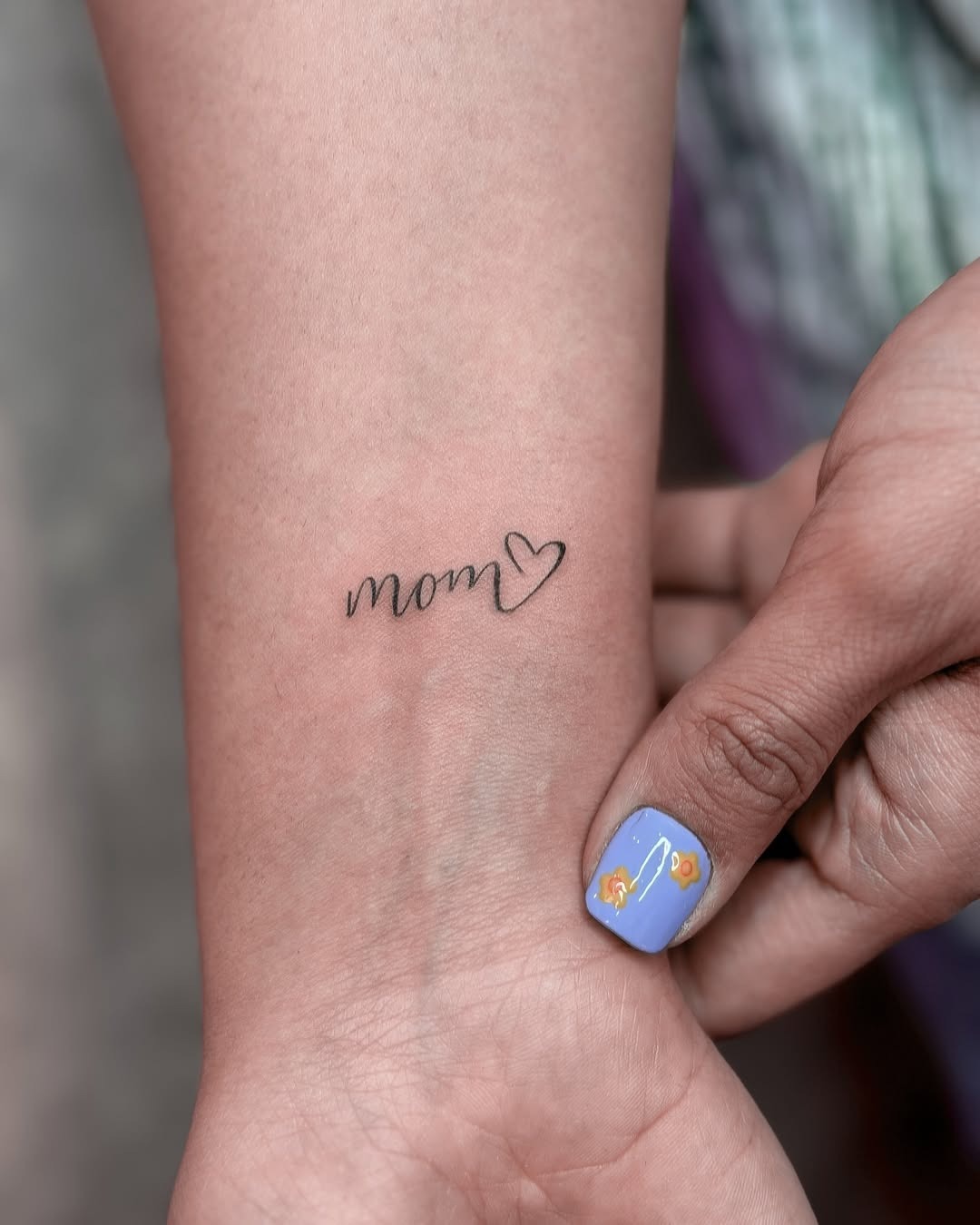 Elegant mom tattoo with a heart detail Tattoo Design