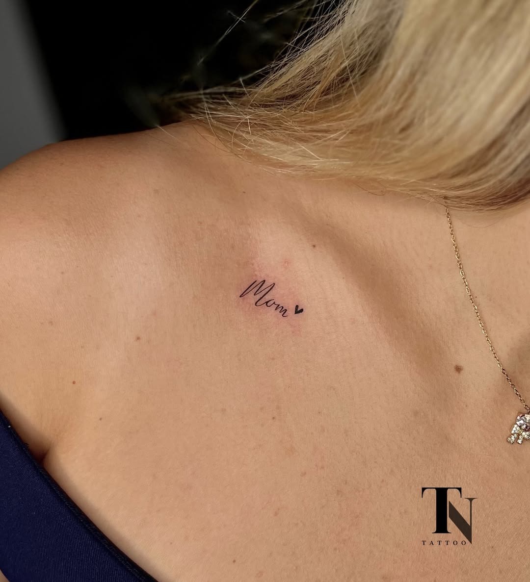 Elegant tribute to motherhood with minimalistic design Tattoo Design