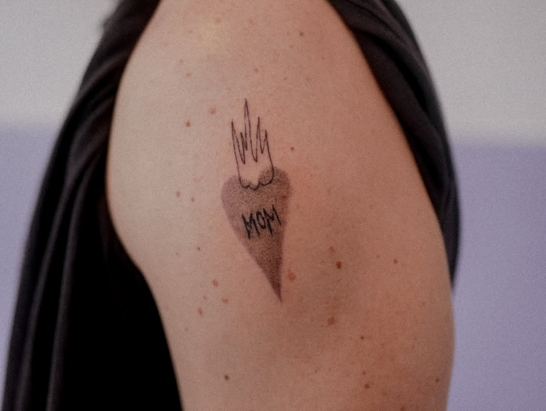 Flame-inspired heart tattoo honoring mothers Tattoo Design